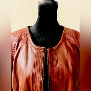 Collarless leather moto jacket with zipper and pockets